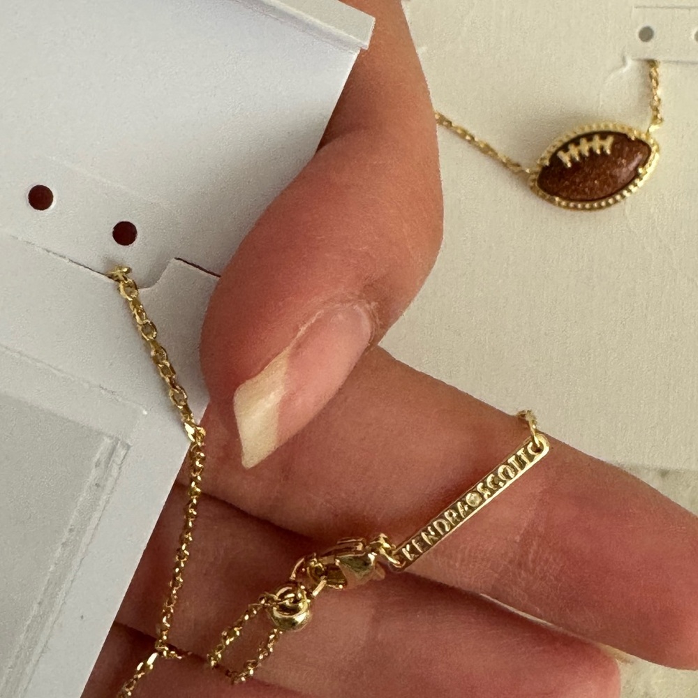 Kendra Scott 14k Plated Gold and Orange Sandstone Football Pendant Necklace - Picture 6 of 13